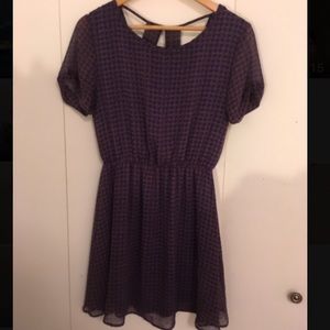 Purple and gold pattern dress.